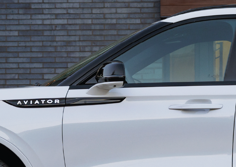 The driver’s door of a white 2025 Lincoln Aviator® SUV is showcased. | Capital Lincoln of Wilmington in Wilmington NC