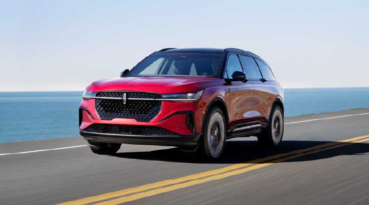 A 2025 Lincoln Nautilus® SUV is being driven on a seaside roadway. | Capital Lincoln of Wilmington in Wilmington NC