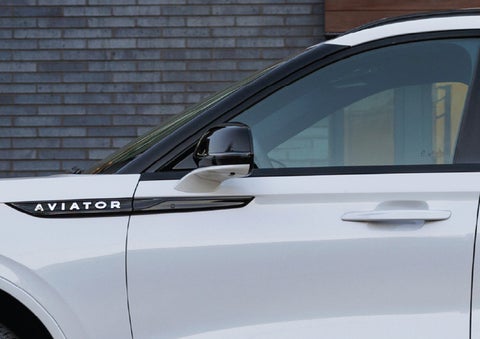 The driver’s side door and fender badging of a white 2026 Lincoln Aviator® SUV are showcased. | Capital Lincoln of Wilmington in Wilmington NC