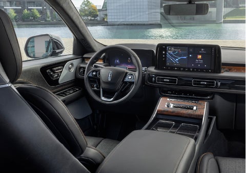 The interior of the 2026 Lincoln Aviator® SUV is shown parked with a view of a harbor through the windshield. | Capital Lincoln of Wilmington in Wilmington NC