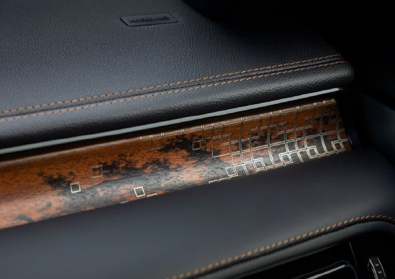 A close-up shot of the 2026 Lincoln Aviator® dashboard with unique black and brown accents and brown stitching. | Capital Lincoln of Wilmington in Wilmington NC