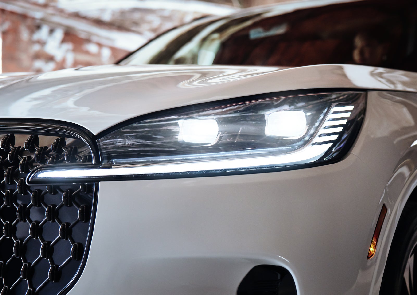 A close-up of a headlamp on the 2027 Lincoln Aviator® SUV is shown. | Capital Lincoln of Wilmington in Wilmington NC