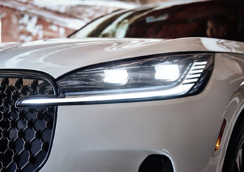 A close-up of a headlamp on the 2027 Lincoln Aviator® SUV is shown. | Capital Lincoln of Wilmington in Wilmington NC