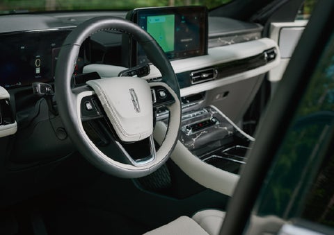 The leather-trimmed steering wheel of a 2027 Lincoln Aviator® Black Label™ SUV. | Capital Lincoln of Wilmington in Wilmington NC