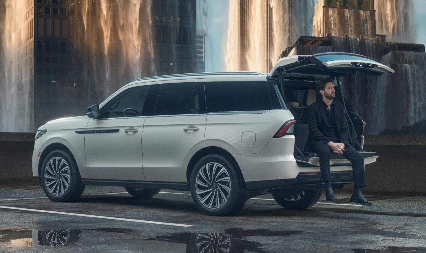 Man sitting in the trunk of his Lincoln