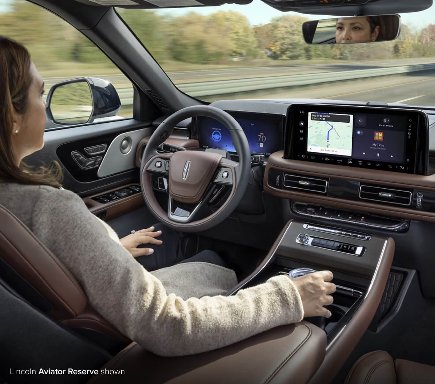 Woman driving lincoln with autonomous driving feature