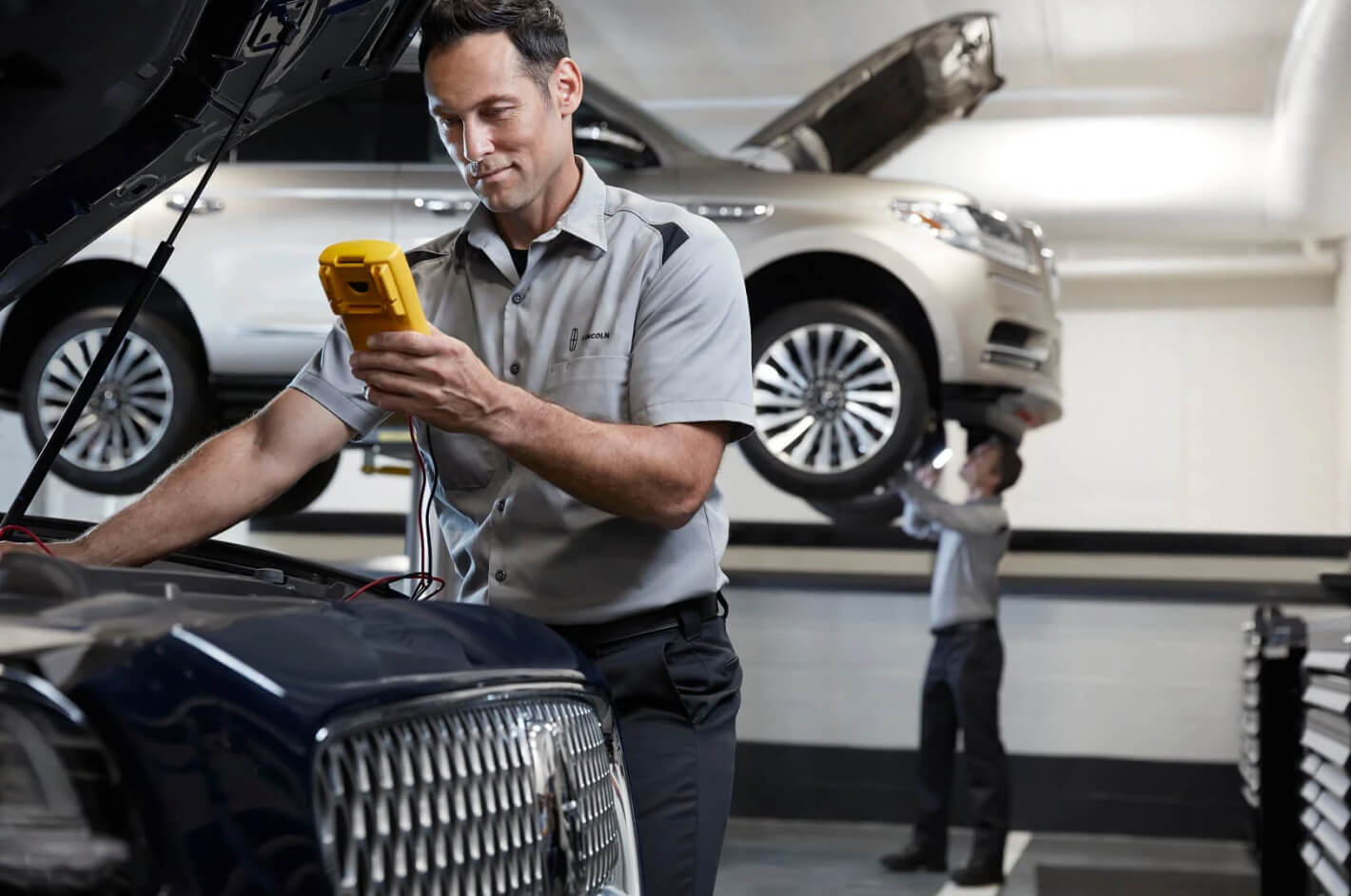 Lincoln Service technician working under the hood