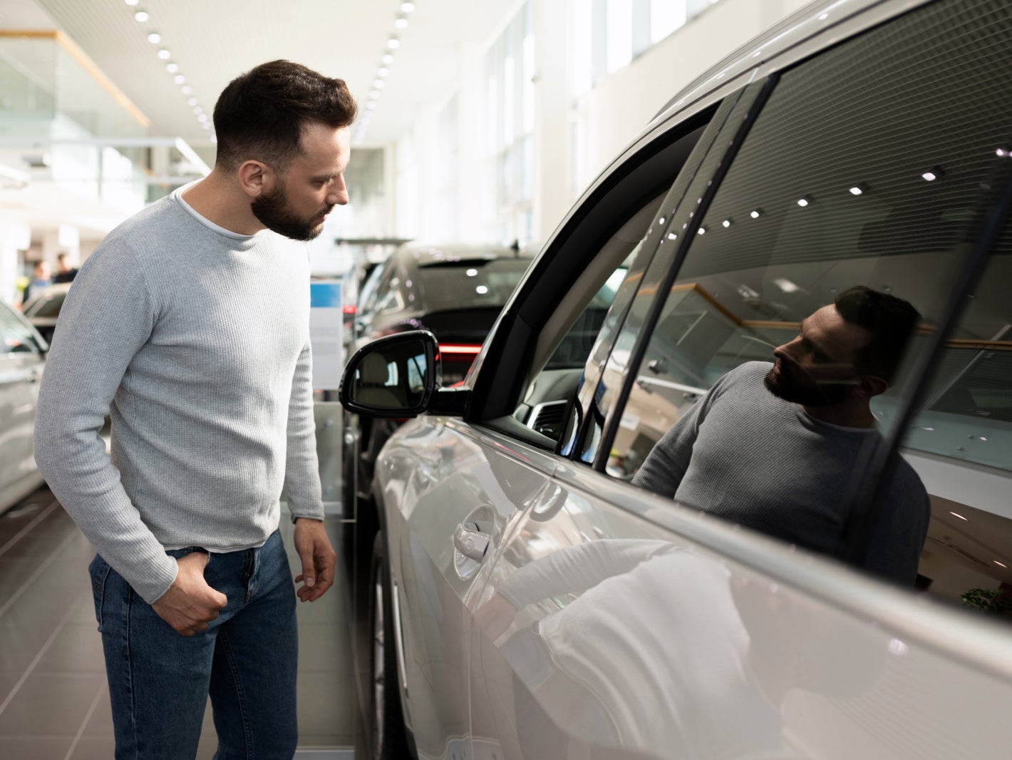 Customer browsing Lincoln vehicles to purchase